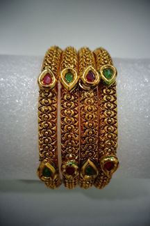 Picture of Peaceful maroon & green bangles with stone work