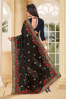 Picture of Bold black saree with red & green resham