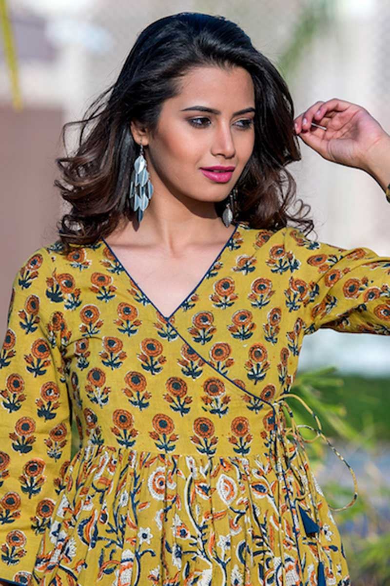 0098787 yellow colored partywear printed muslin kurti