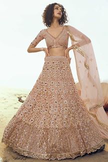 Picture of Glorious Peach Colored Partywear Embroidered Net Lehenga Choli