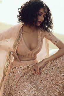 Picture of Glorious Peach Colored Partywear Embroidered Net Lehenga Choli