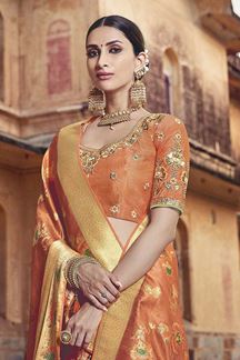 Picture of Orange Colored Dola Silk Wedding Saree With Tassels