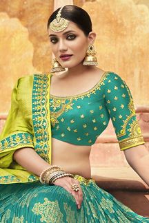 Picture of Spectacular Rama and Parrot Green Colored Designer Silk Lehenga Choli