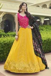 Picture of Outstanding Yellow and Deep Pink Colored Designer Lehenga Choli