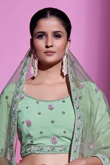 Picture of Glamorous Pista Green Colored Designer Lehenga Choli