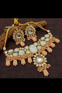 Picture of Appealing Peach Colored Designer Kundan Necklace Set
