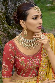 Picture of Classy Golden Yellow and Peach Colored Designer Lehenga Choli